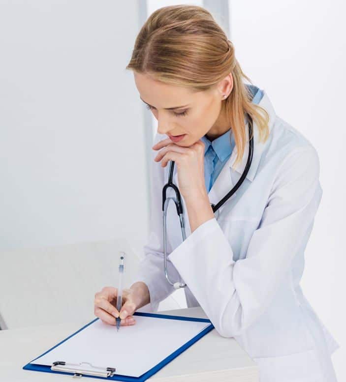 A doctor going over allergy testing results on a clipboard