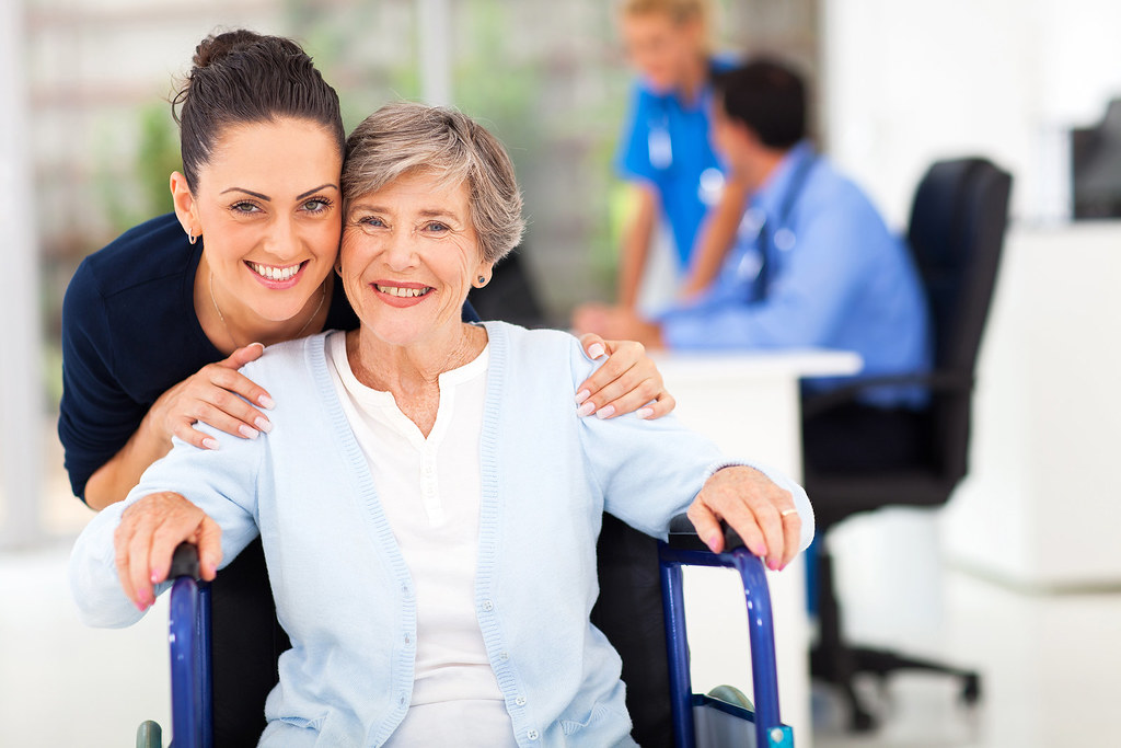 Primary Care for Older Adults: What Changes After 65? 2 Adult daughter accompanying senior mother at a primary care doctor visit
