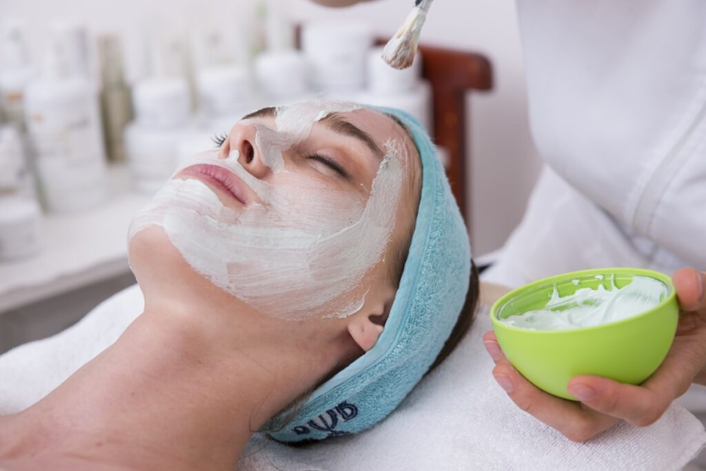 Person examining skin on one side of the face