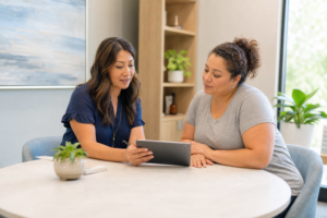 Clinician and patient reviewing a medical weight loss plan in a Plano clinic